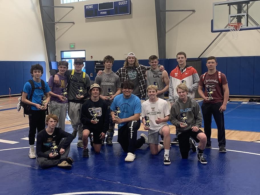 Wrestlers from Western Montana competed last weekend in St. Ignatius for the Isaiah Allik benefit tournament. Allik, a state champion wrestler for the Mission-Charlo Bulldogs in 2020, was diagnosed with cancer while at Montana Tech as he prepped for football season. Allik, in the middle of the back row with his cap turned backward, posed for a photo with the winners at the tournament. (Photo courtesy Kami Milender)