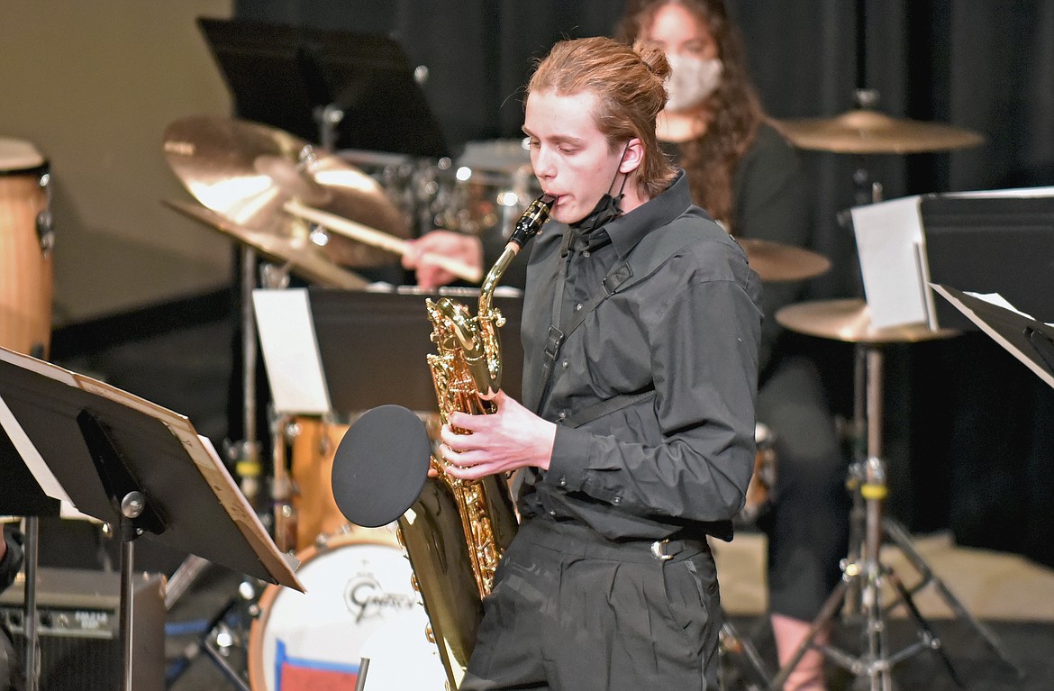 Aidan Calaway plays the baritone saxophone during the WHS Jazz Band's live performance on Thursday. (Whitney England/Whitefish Pilot)