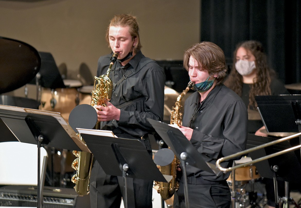 Musicians Aidan Calaway, baritone saxophone, and Owen Meador, alto saxophone, play during the WHS Jazz Band's live performance on Thursday. (Whitney England/Whitefish Pilot)