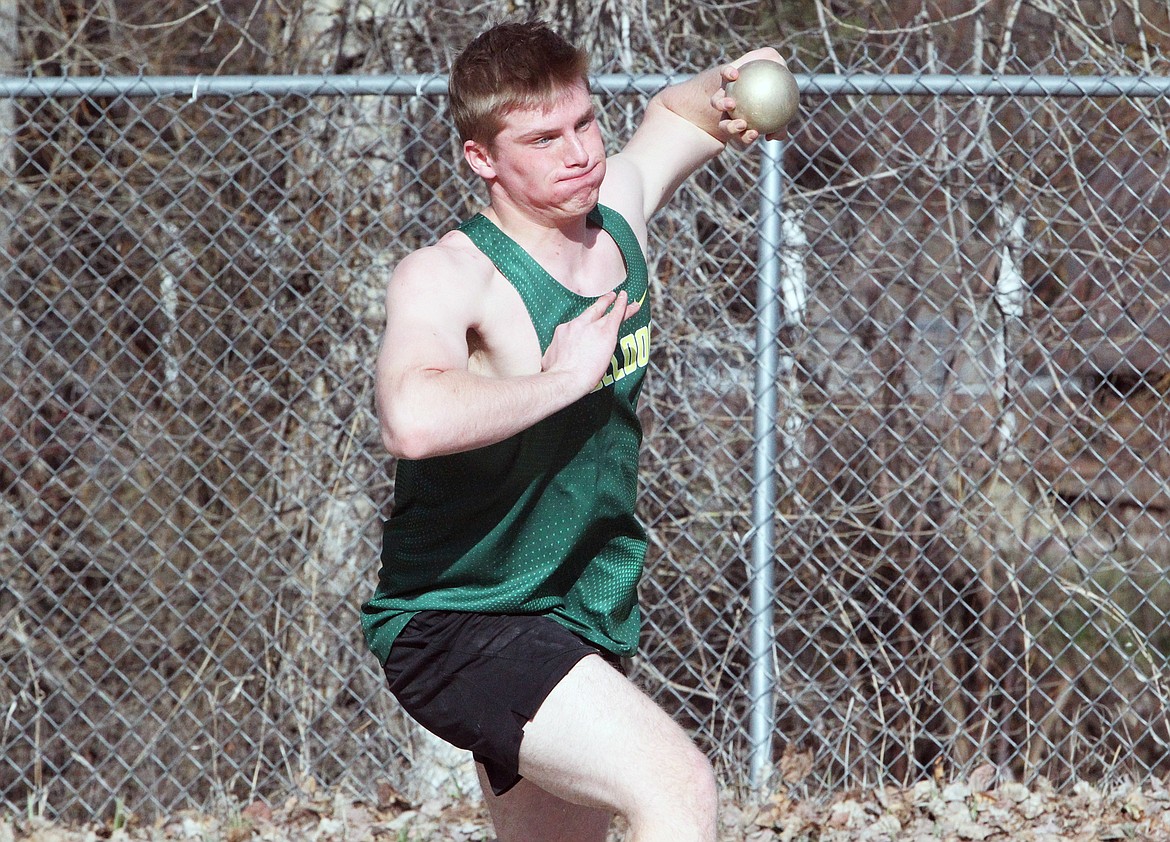 Whitefish's Ben Dalen competes in shot put at the track and field meet in Libby on Friday. (Will Langhorne/The Western News)