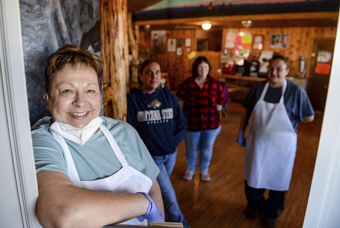 Ann Magee, left, manages the Junction Cafe in Browning, Mont. She says that business has been good since the tribal council's decision to reopen the reservation. She says that despite the reopening, ownership and employees are still in favor of take-out service only for the time being. (Rion Sanders/The Great Falls Tribune via AP)