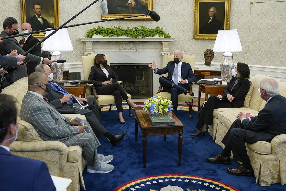 President Joe Biden and Vice President Kamala Harris meet with lawmakers to discuss the American Jobs Plan in the Oval Office of the White House, Monday, April 12, 2021, in Washington.