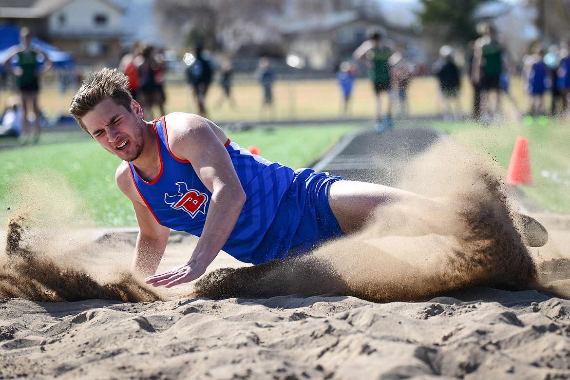 Bigfork's Cormac Benn competes in the long jump during a track and field meet with Flathead and Whitefish high schools at Legends Stadium on Tuesday. (Casey Kreider/Daily Inter Lake)