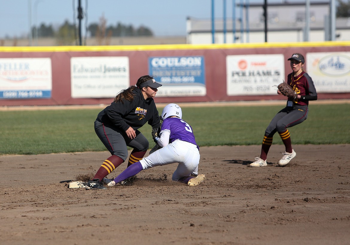 Senior Madi Olson makes the tag for an out at second base on Tuesday afternoon in the season opener against Wenatchee at MLHS.