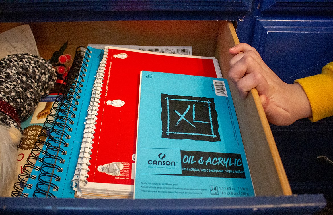 The majority of drawers in Nora Finnegan Hines' bedroom at her family home outside Moses Lake are filled with sketchbooks and collections of her drawings.