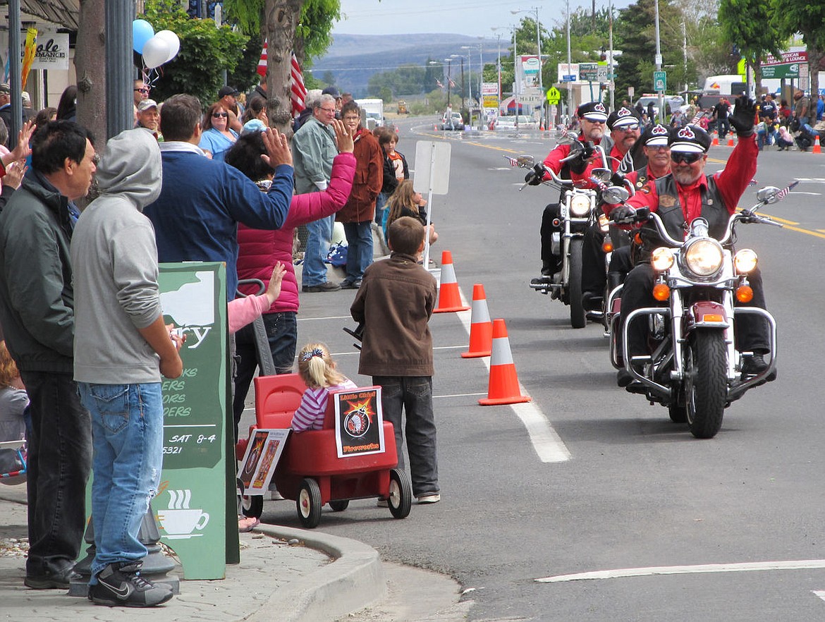 Motorcycles roar through Ephrata at a past Sage n Sun parade.