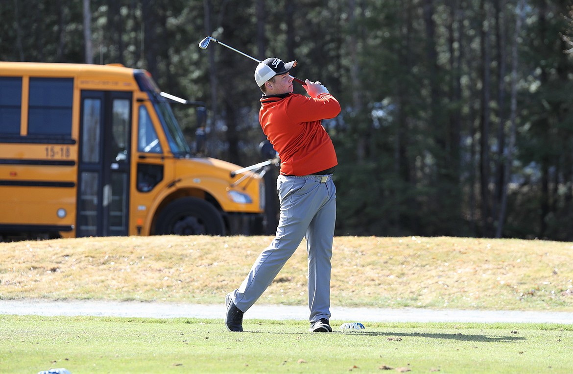 Kameron Salesky holds his follow through on his tee shot at hole No. 1 on Monday.