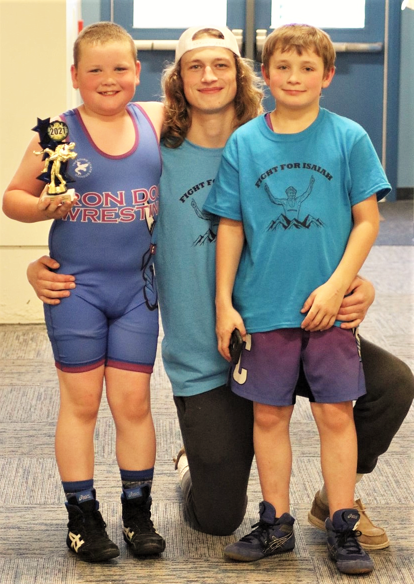 2020 state wrestling champ Isaith Allik poses with William Sharbono and Isaiah's brother, Levi Dwelle. More than 350 youth, from near and far, participated in the wrestling tourney held last weekend to "Fight for Isaiah" as he battles a rare cancer in his leg. (Courtesy of Michelle Sharbono)