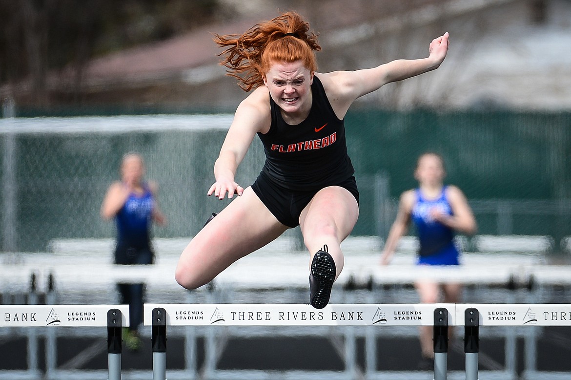 Flathead's Skyleigh Thompson clears a hurdle in the girls' 300 meter hurdles at a track and field meet at Legends Stadium on Tuesday. (Casey Kreider/Daily Inter Lake)