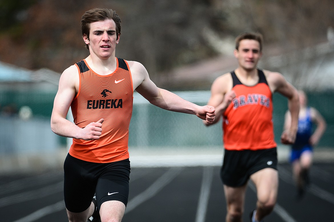 Eureka's Gunnar Smith crosses the finish line in the boys' 400 meter dash at a track and field meet at Legends Stadium on Tuesday. (Casey Kreider/Daily Inter Lake)