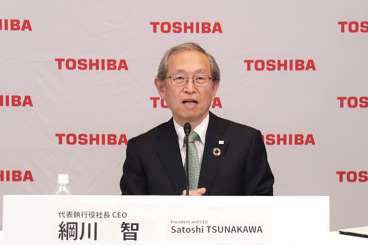 In this image provided by Toshiba Corporation, new Toshiba President Satoshi Tsunakawa speaks during an online press conference in Tokyo, Wednesday, April 14, 2021. Nobuaki Kurumatani, the president of Toshiba Corp. stepped down Wednesday, a week after the Japanese technology and manufacturing giant said it was studying an acquisition proposal from a global fund where he previously worked. Kurumatani will be replaced by his predecessor, Tsunakawa.