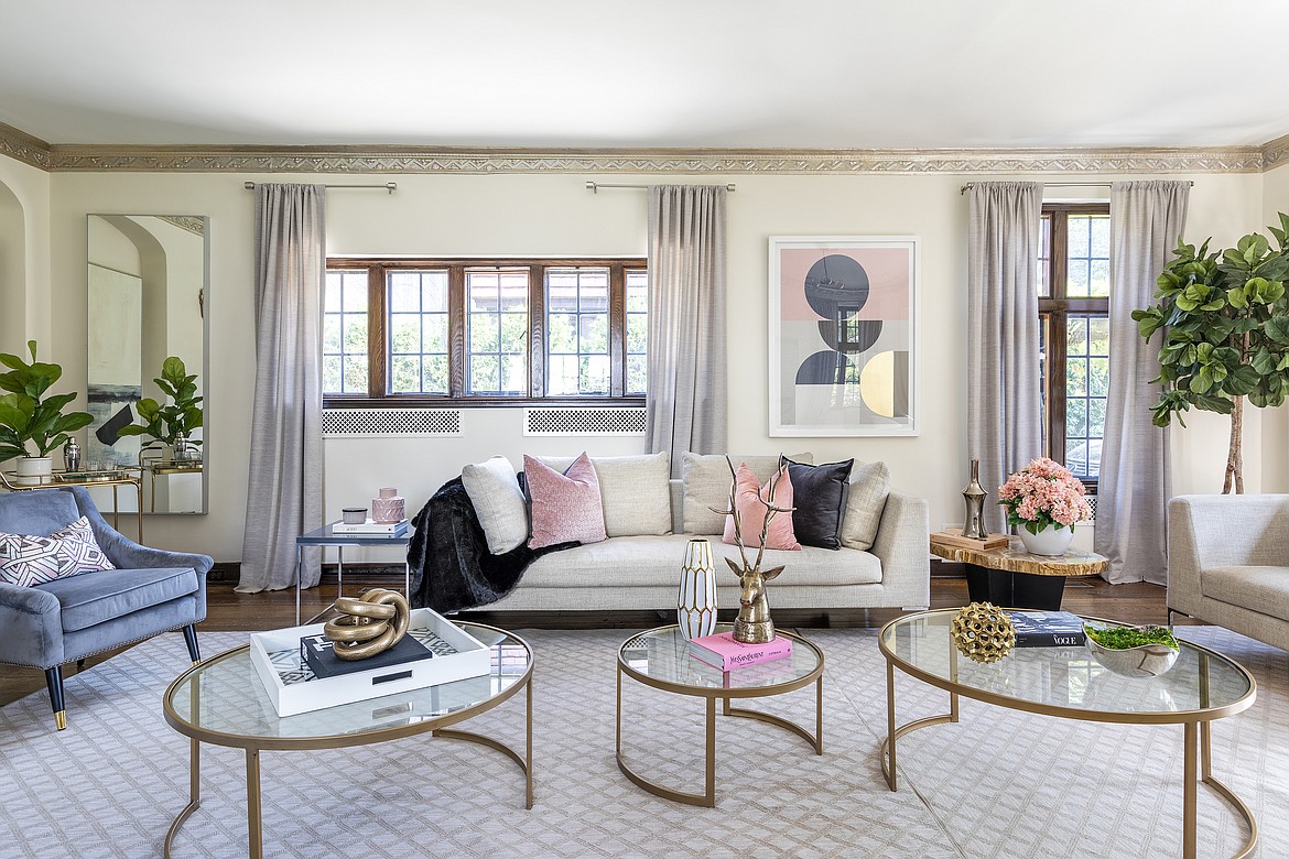 The blend of taupe, black and pink with greenery feels fresh and clean for spring in this living space.