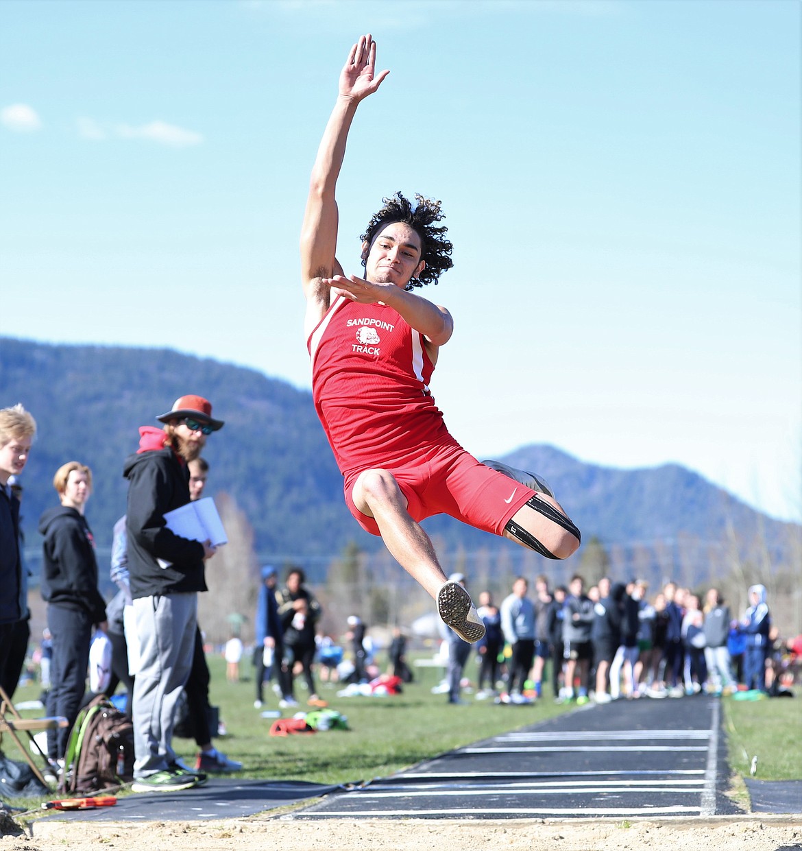 Braden Kappen leaps into the pit during the long jump on Tuesday.