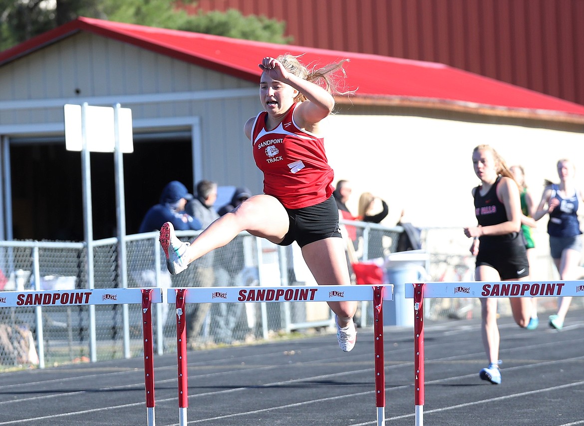 Destiny Lyons takes off in the 300 hurdles Tuesday.