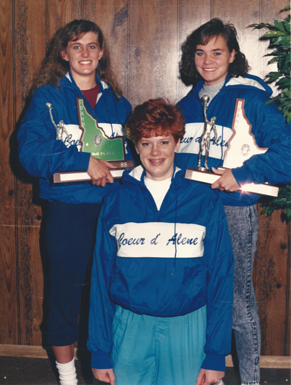Photo courtesy Ann Jaworski
Ann Jaworski, standing at right, Sherri Thormahlen, standing at left, and Colleen (Jantz) Frohlich teamed to bring home Coeur d'Alene's first state volleyball title in 1987. Jaworski is holding the state championship trophy; Thormahlen is holding the Vikings's third-place trophy from the 1988 state basketball tournament. Sherri and her sister, Tara, transferred to Coeur d'Alene from St. Maries in 1987. "Sherri was the most naturally gifted athlete I have ever seen," Jaworski said. Sherri Thormahlen went on to play volleyball and basketball at Long Beach State.