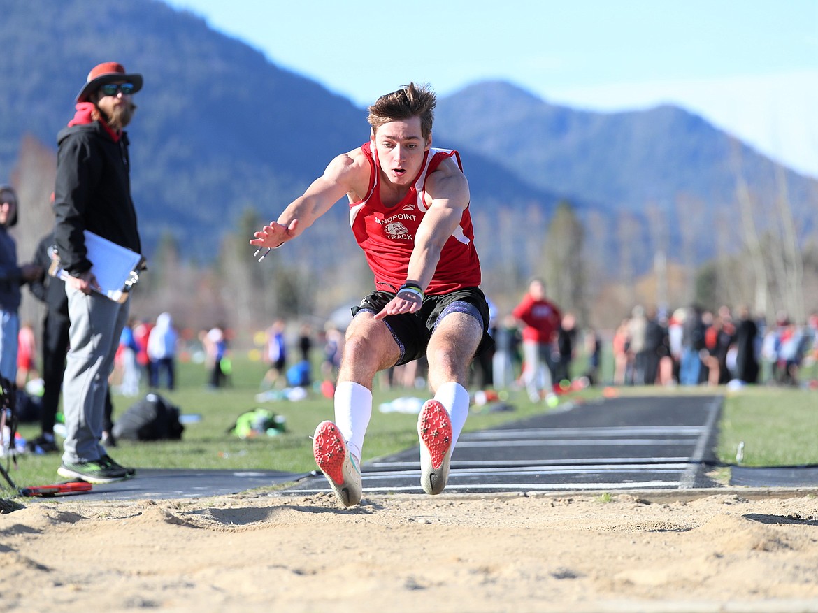 Luke McCorkle prepares to land in the pit during the long jump on Tuesday.