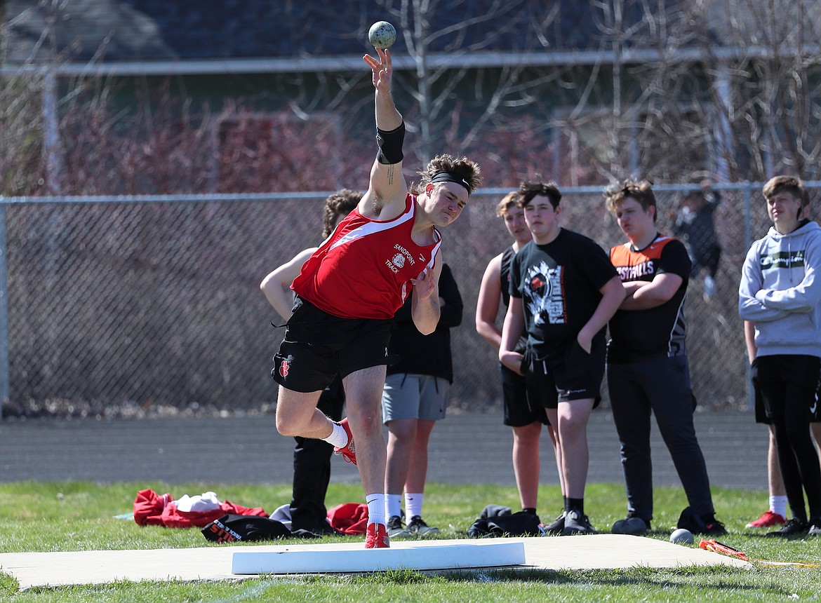 Will Hurst throws the shot put during Tuesday's home meet.