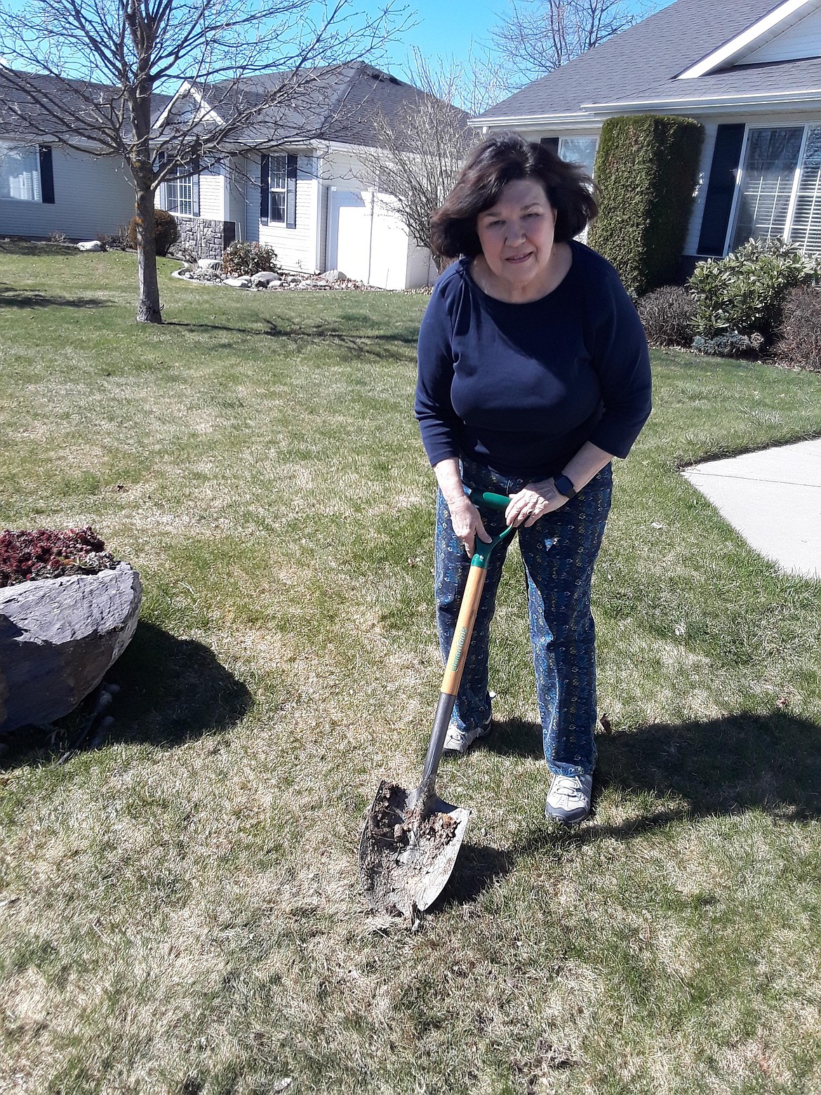 Gloria Wurm and the shovel she used to clean a pile of feces left on her lawn in the early Tuesday morning hours. The Kootenai County Sheriff's Office is investigating the vandalism, in which Wurm's porch flag showing support for then-candidate Joe Biden was ripped off her wall. (CRAIG NORTHRUP/Press)