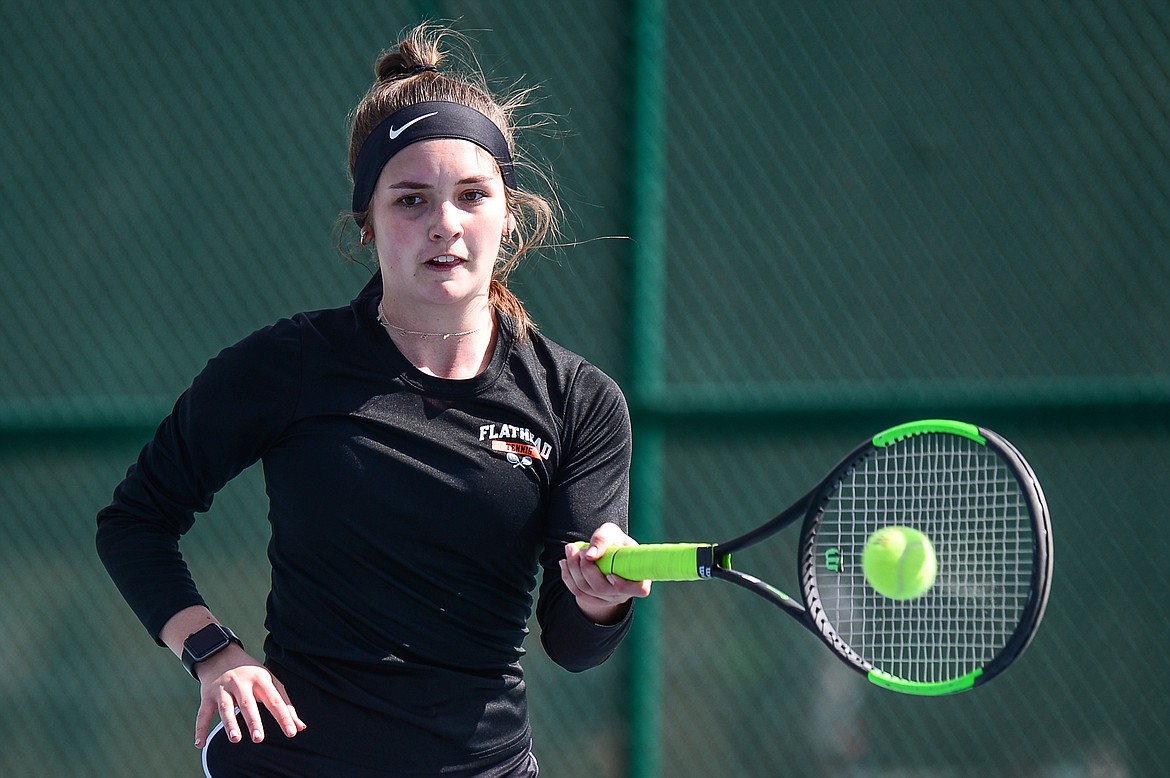 Flathead's Avery Cherot hits a return against Glacier's Mackenzie Baker at Flathead Valley Community College on Thursday. (Casey Kreider/Daily Inter Lake)