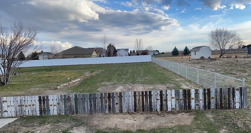 A fencing project completed by Cortez Fencing  with three different types of fencing blended together.