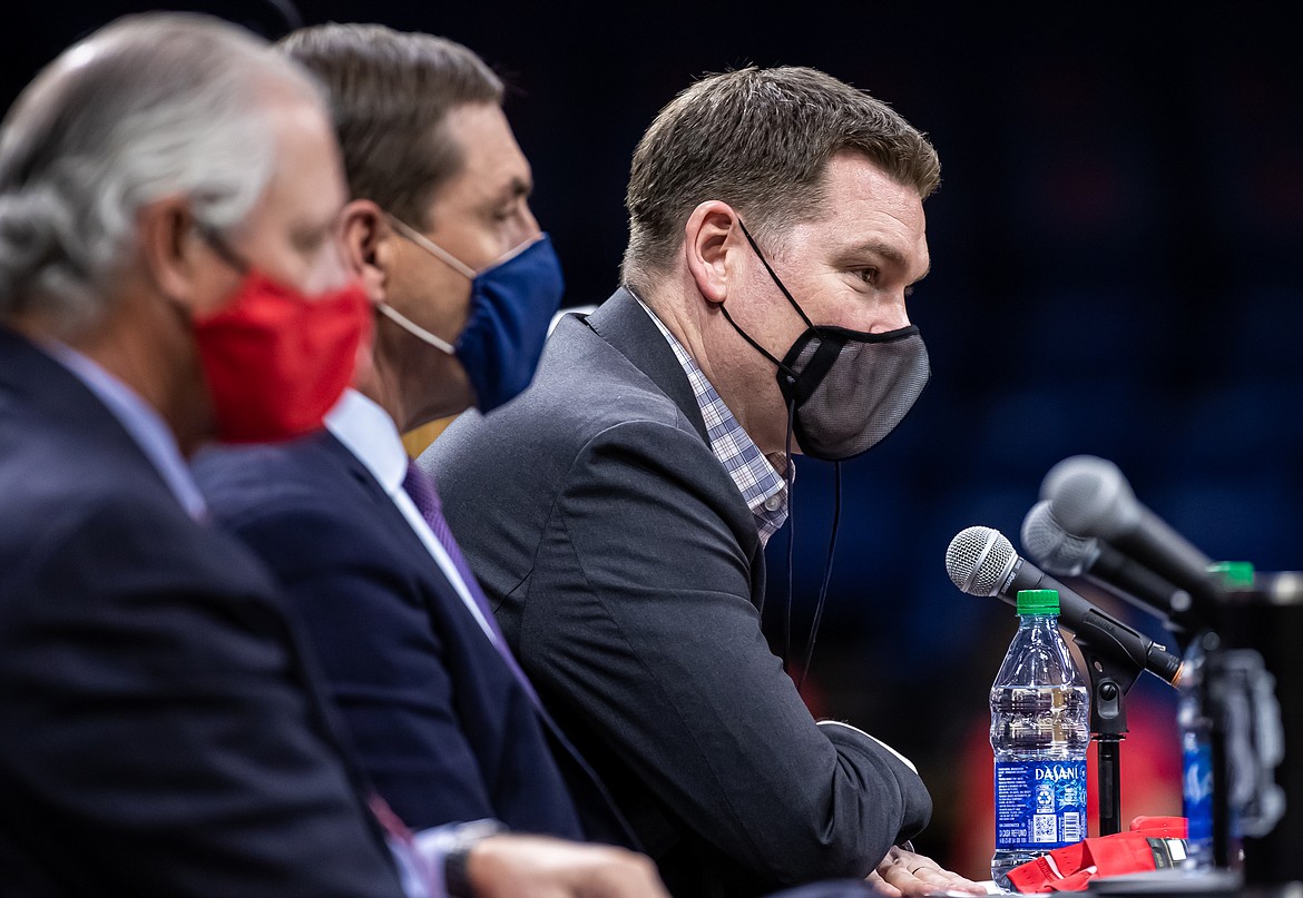 MIKE CHRISTY/Arizona Athletics
From left, University of Arizona president Dr. Robert C. Robbins, Arizona athletic director Dave Heeke and new Arizona men's basketball coach Tommy Lloyd, the former Gonzaga assistant.