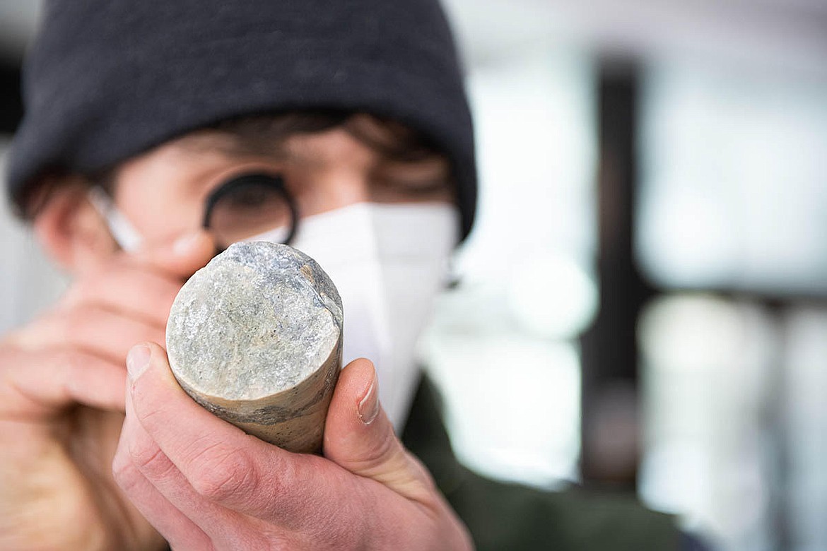 Photos courtesy University of Idaho/Ralph Bartholdt
Graduate geology student Liam Knudsen, of Moscow, exams a section of core provided by Hecla Mining Company with a hand lens during a core logging workshop in the IRIC building.