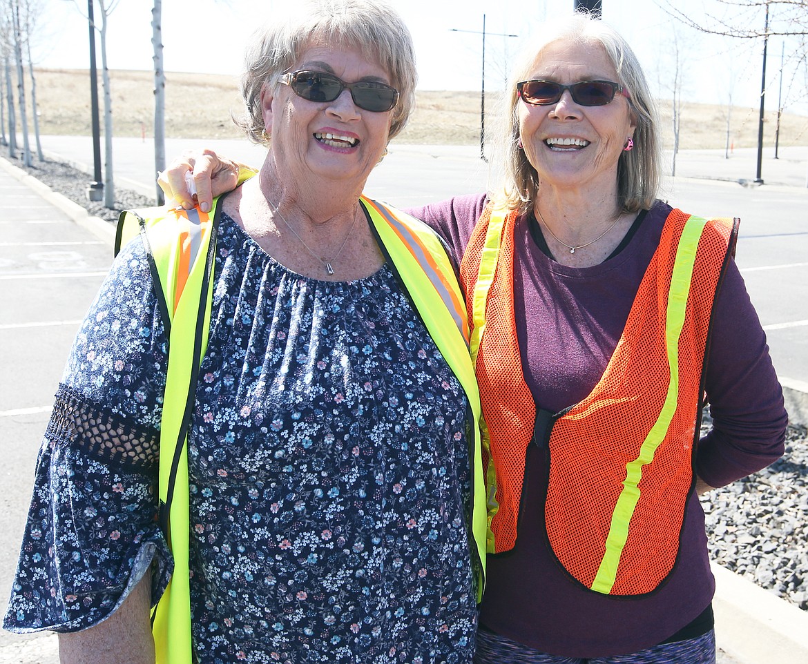 Linda Chicarilli, left, and Marcia Kramer volunteer at Saturday's food giveaway outside the Coeur d'Alene Casino on Saturday.