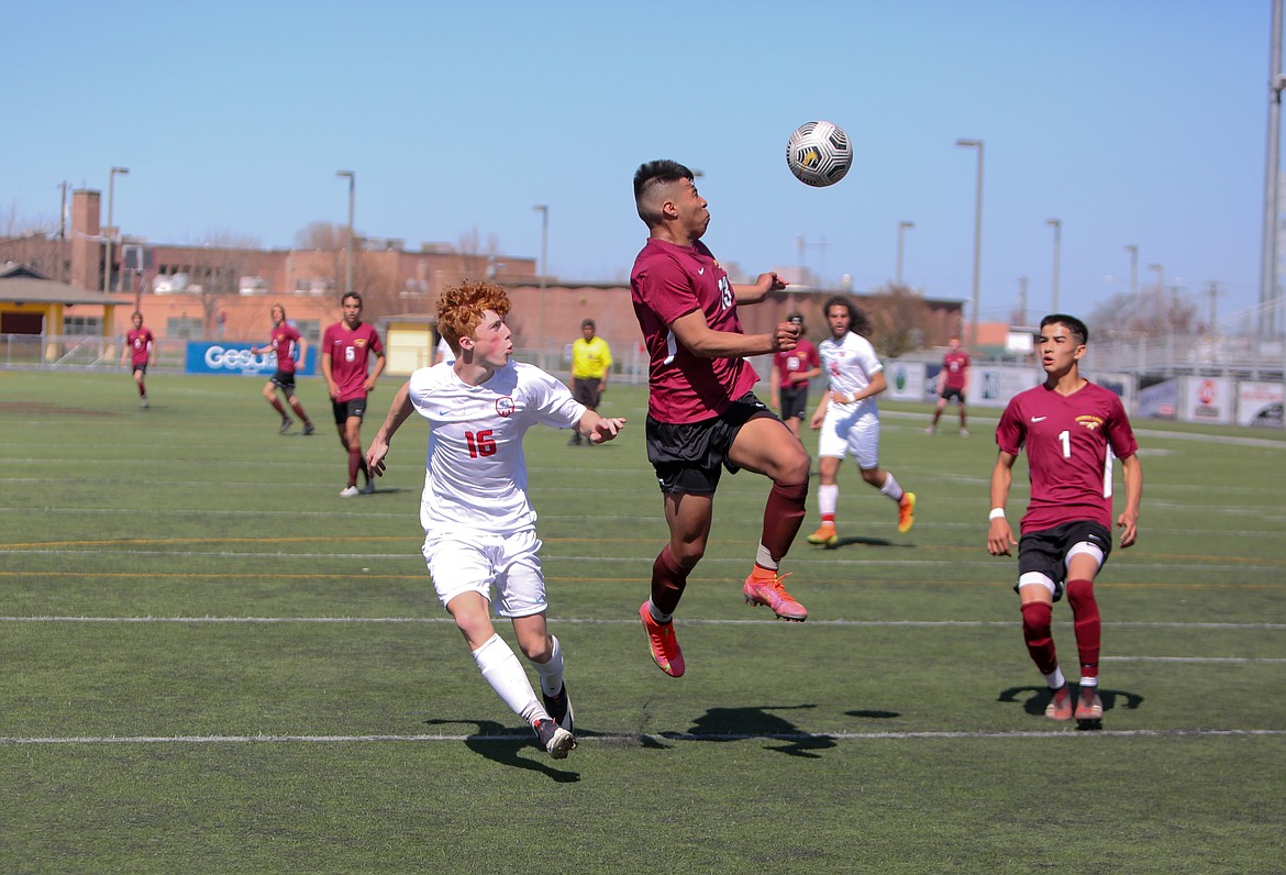 Moses Lake's Abraham Morales skies up for a header near the Eastmont goal on Saturday afternoon at Lions Field.