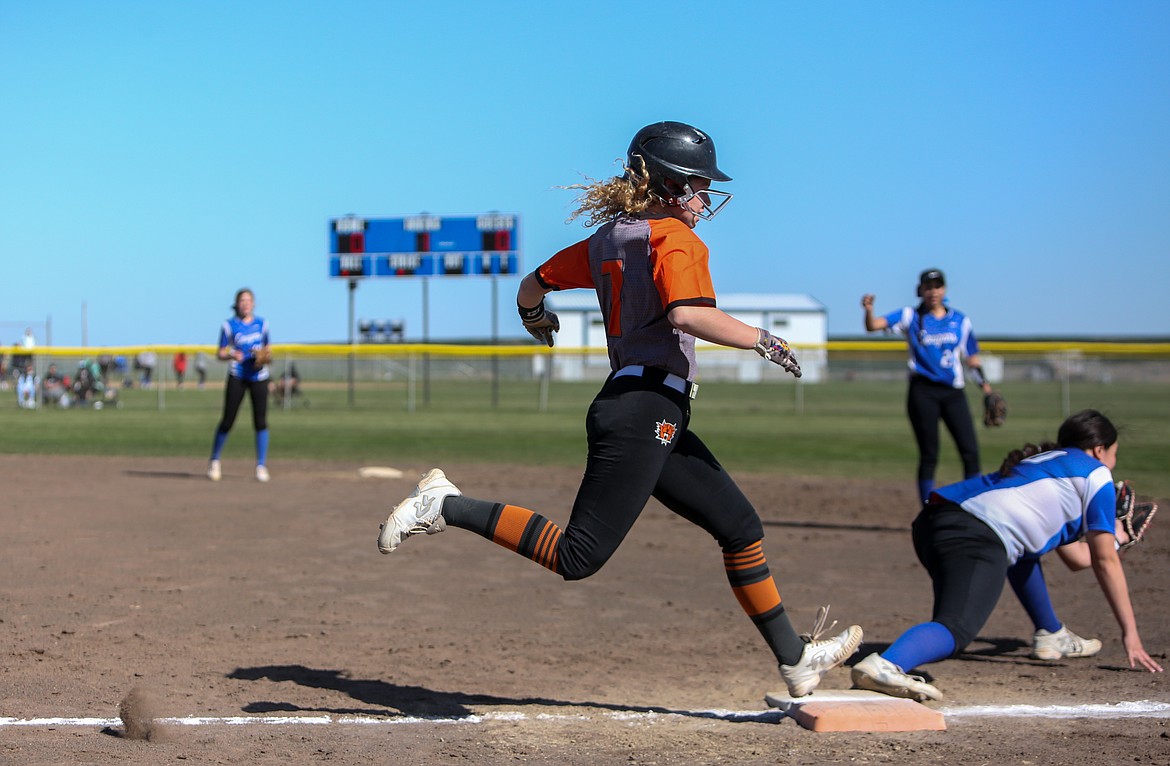 Ephrata's Rylee Peters looks to beat the tag in the first inning as Warden's Alexsus Leinweber makes the catch for the out on Friday afternoon at Warden High School.