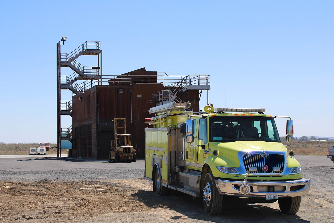 A District 5 fire truck in front of the burn building on the property of the new facility-to-be on Monday.