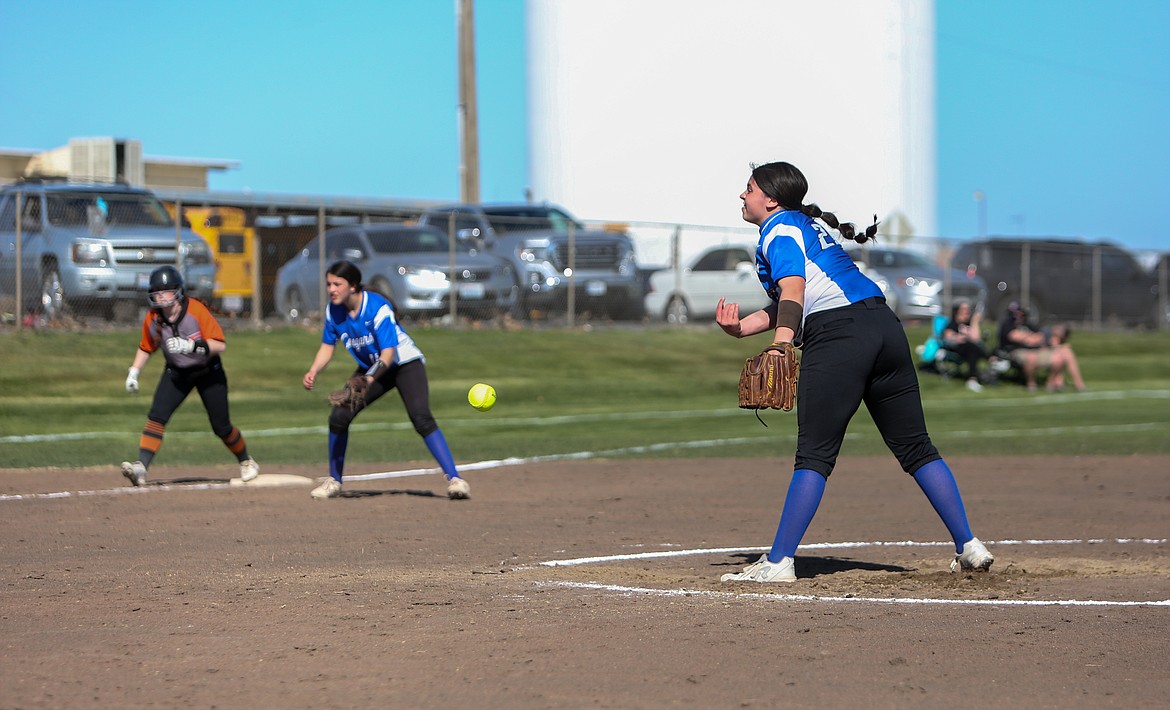 Warden High School's Alexsus Leinweber fires a pitch from the mound against Ephrata in the opening game of the doubleheader on Friday afternoon at Warden High School.