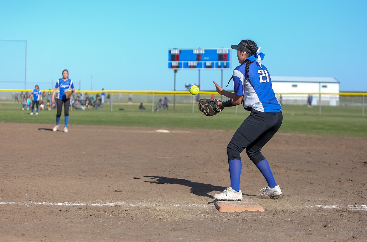 Jlynn Rios makes a catch at first base for the out in the doubleheader series versus Ephrata High School on Friday afternoon at Warden High School.