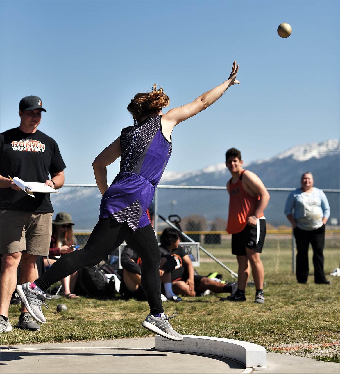 Kyla Tomlin of Charlo launches a throw during the girls shot put competition. Tomlin managed a personal record of 28 feet 1.5 inches. (Scot Heisel/Lake County Leader)