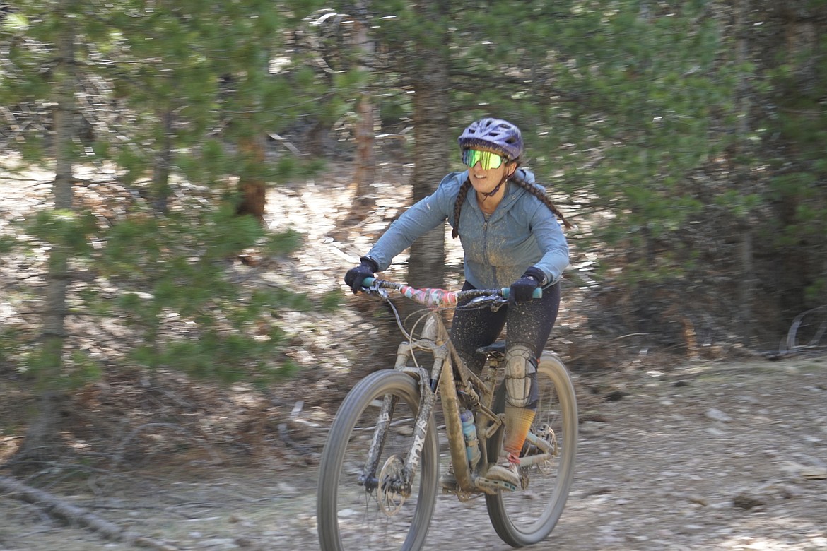 Women's overall title winner Katie Camarata, from Donelly, Idaho, zooms down the biking portion of the 2021 Leadman Triathlon.