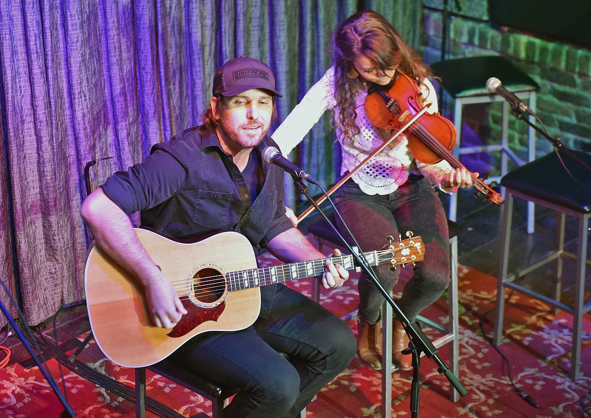 Local Whitefish musicians Andrew Sweeney and Hannah King perform with the "Nashville Heads West Songwriter Showcase" at Casey's Whitefish on Thursday. (Whitney England/Whitefish Pilot)