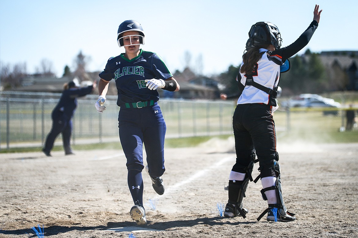 Glacier's Avery Anderson (16) scores on an RBI single by Sammie Labrum (10) against Flathead in the first game of a crosstown doubleheader at Kidsports Complex on Tuesday. (Casey Kreider/Daily Inter Lake)