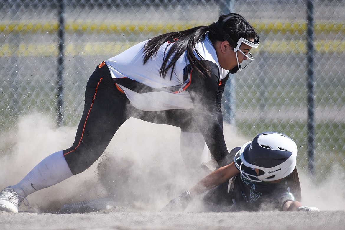 Flathead third baseman Brianna Morales (32) puts the tag on Glacier's Kenna Vanorny (5) as she attempts to steal third base during the first game of a crosstown doubleheader at Kidsports Complex on Tuesday. (Casey Kreider/Daily Inter Lake)