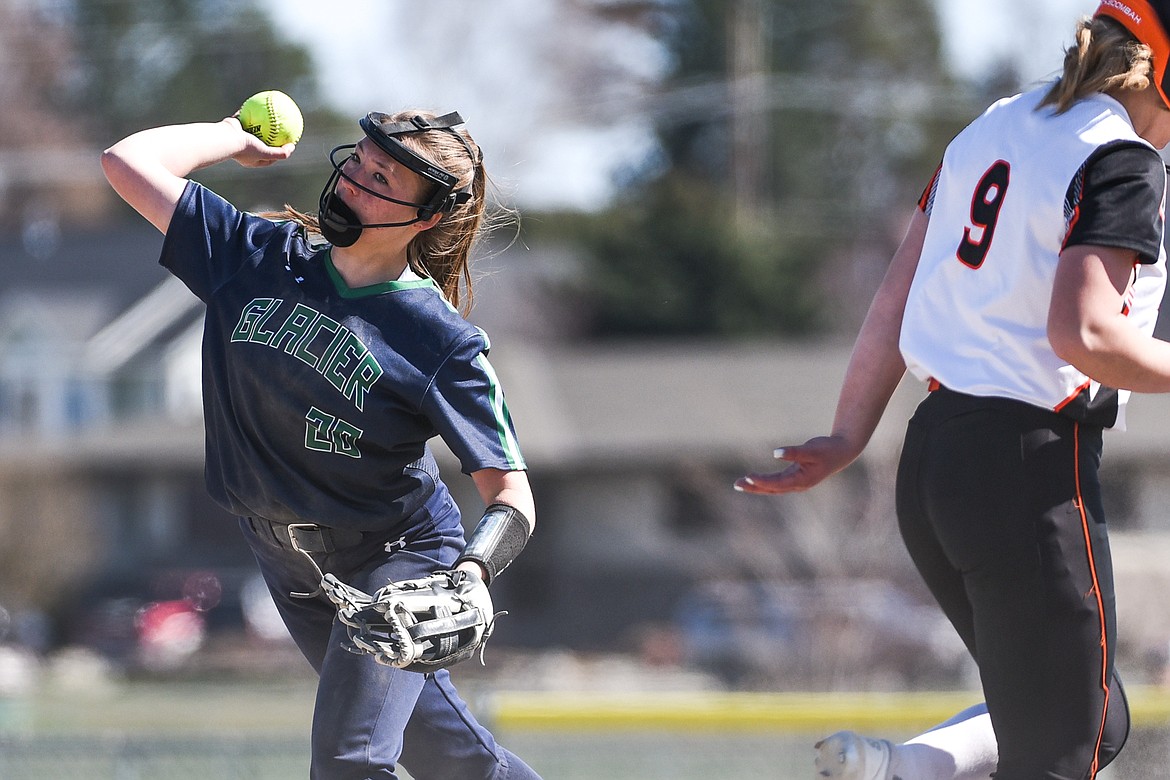 Glacier second baseman Kenadie Goudette (20) fires to first to try and complete a double play against Flathead during the first game of a crosstown doubleheader at Kidsports Complex on Tuesday. (Casey Kreider/Daily Inter Lake)