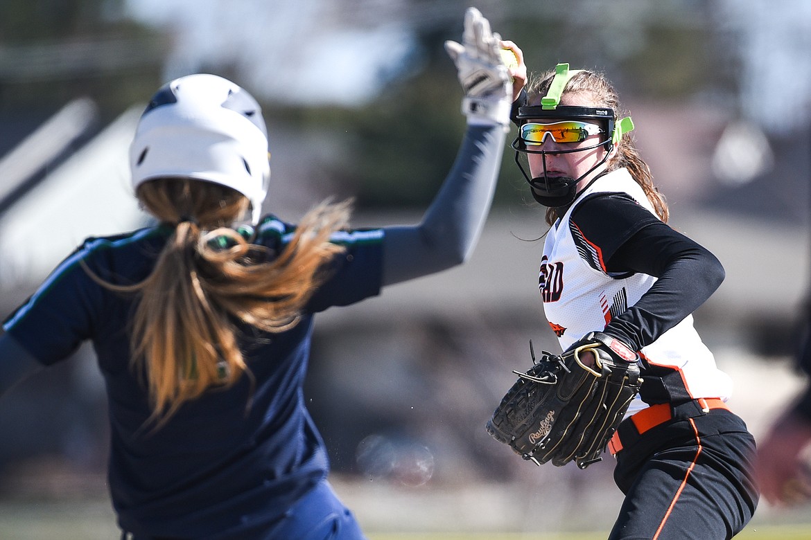 Flathead shortstop Kaidyn Lake (10) forces out Glacier's Halle Schroeder (2) at second base while trying to turn a double play during the first game of a crosstown doubleheader at Kidsports Complex on Tuesday. (Casey Kreider/Daily Inter Lake)