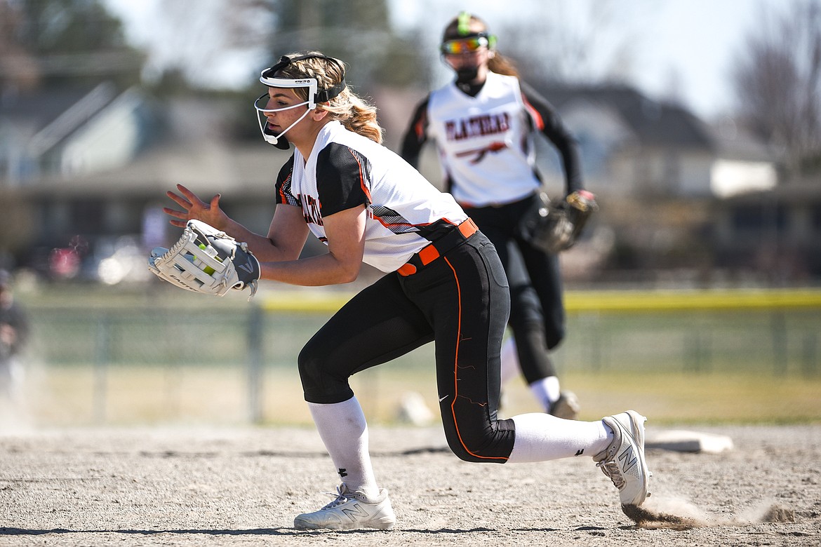 Flathead second baseman Alyssa Cadwalader (9) catches a line drive for an out against Glacier during the first game of a crosstown doubleheader at Kidsports Complex on Tuesday. (Casey Kreider/Daily Inter Lake)