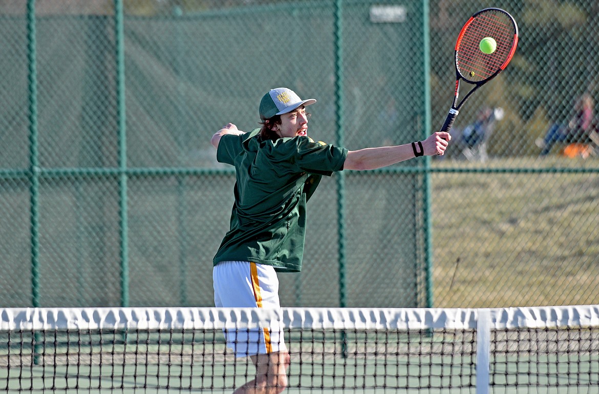 Whitefish senior Jayce Cripe hits a volley in a boys singles match against Havre on Saturday at Flathead Valley Community College. (Whitney England/Whitefish Pilot)