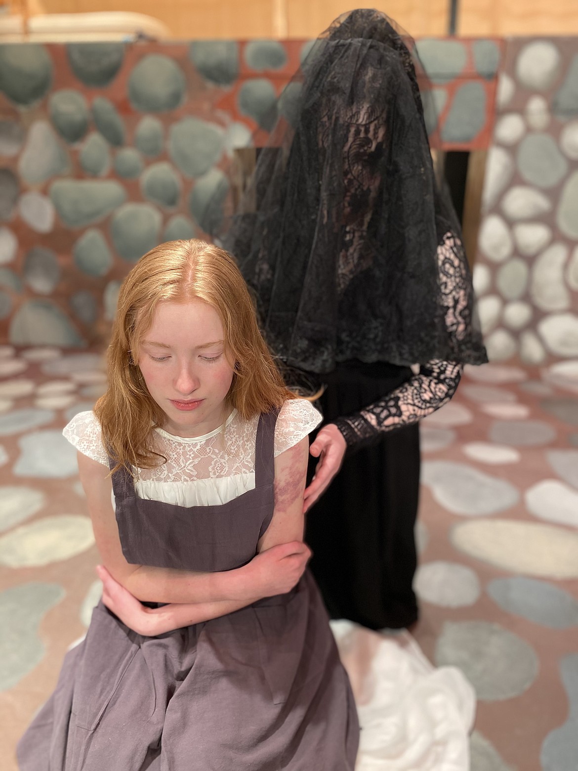 Ashgirl (Kadence Johnson) (foreground) and Sadness (Ella McGuffie) appear in Flathead High School Theatre Department's production of "The Ash Girl."