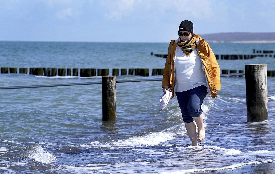 Simone Ravera, patient of the 'MEDIAN Clinic Heiligendamm', makes exercises after an interview with the Associated Press in Heiligendamm, northern Germany, Wednesday, April 14, 2021. The MEDIAN Clinic, specialized on lung diseases, treats COVID-19 long time patients from all over Germany.