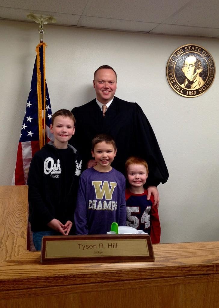 Judge Tyson Hill with sons, from the left, Kallen, Weston and Liam.