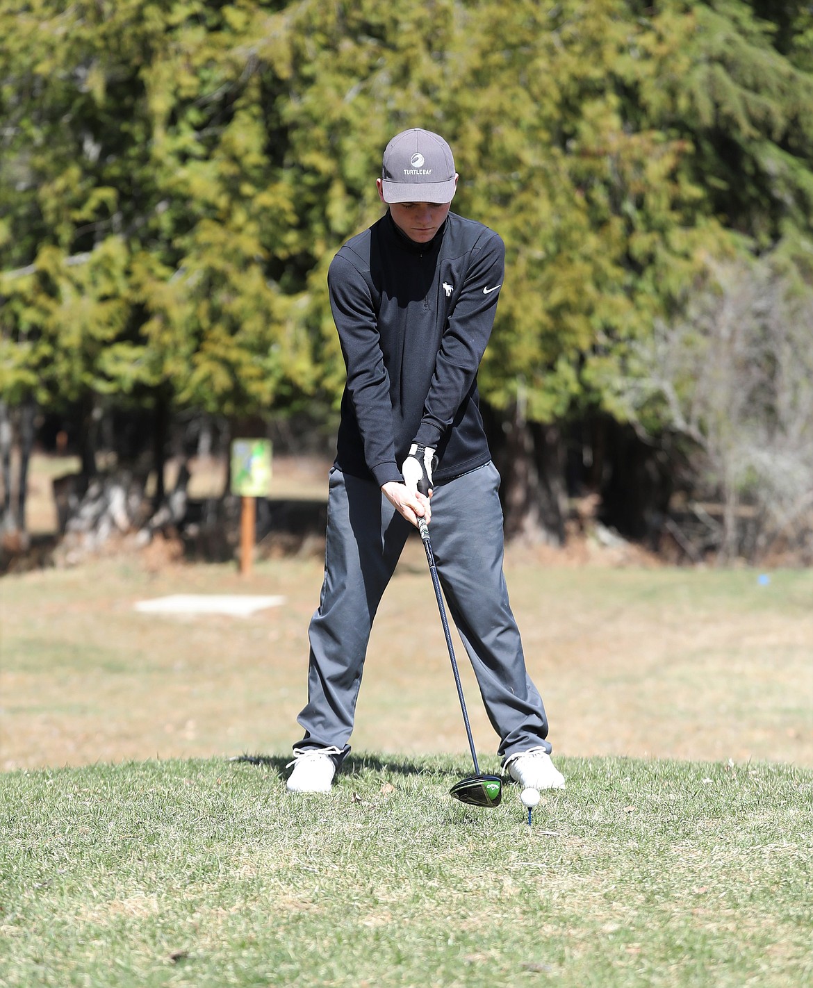 Cole Reuter setups for a drive during practice at Wampus Park last year. Reuter placed sixth at the 3A Idaho state golf tournament in 2021.