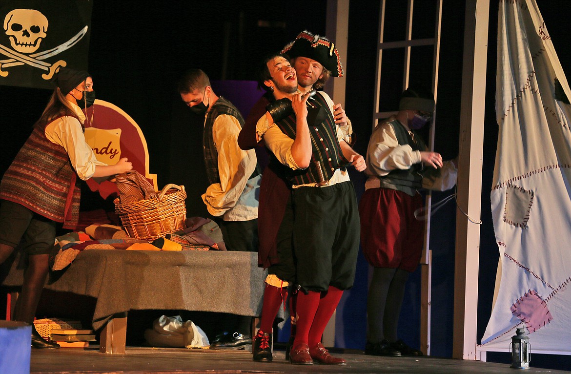 Captain Hook (Alex McGlothen) has a word with Smee (Kobe Johnson) in this scene from Coeur d'Alene High School's production of "Peter/Wendy," which runs through May 1. Pirates also pictured, from left: Emma Keith, Wyatt Warner and Sofia Galletti.