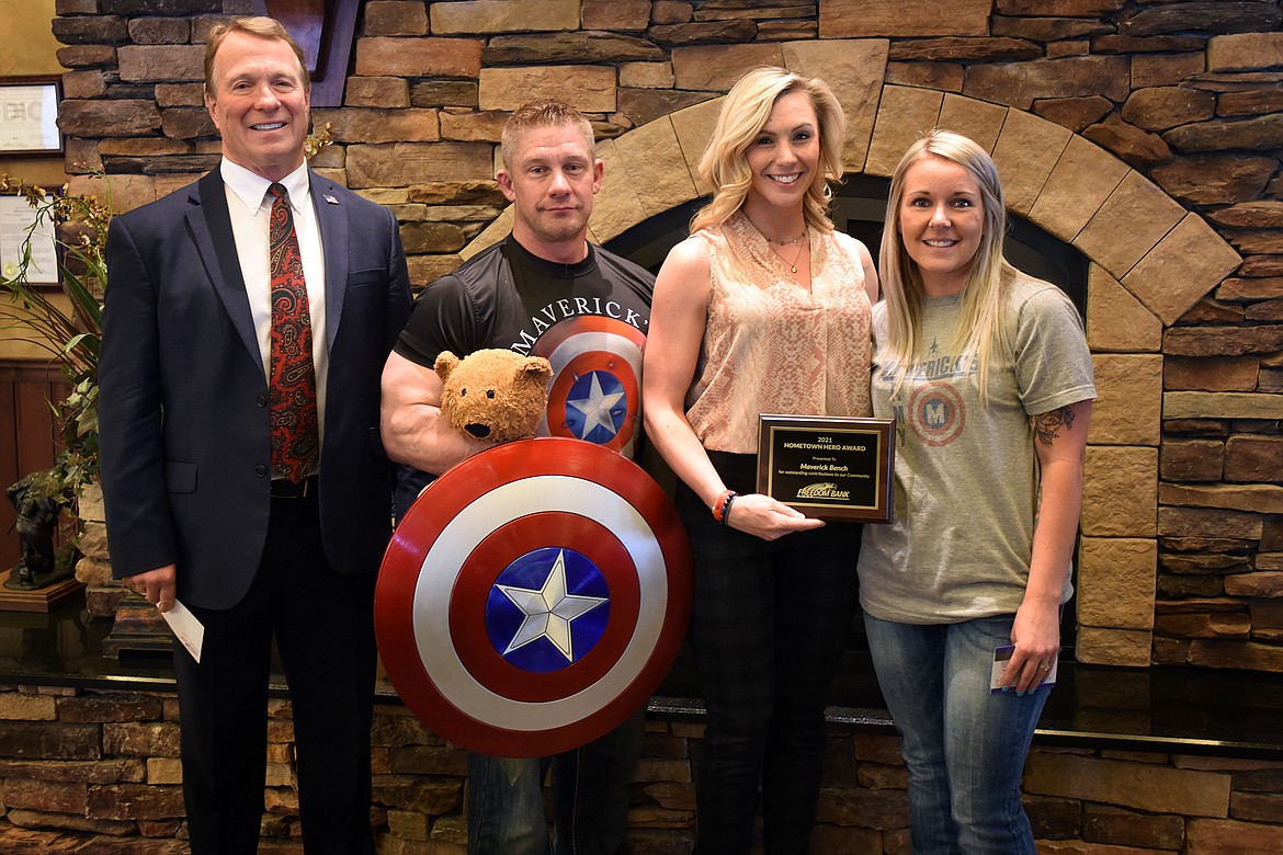 Maverick Bench was selected as the March Freedom Bank Hometown Hero. His parents accepted the award in Columbia Falls Wednesday. Pictured, from left, are bank president Don Bennett, Logan Bench, Colleen Bench and Megan Luce, who nominated Maverick for the award. (Jeremy Weber/Daily Inter Lake)