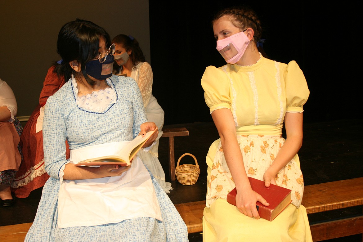 Ruby Gillis (Camila Diaz-Salas, left) and Minnie May Berry (Brooke Melburn, right) discuss their schoolwork in the Quincy High School production of "Anne of Green Gables."