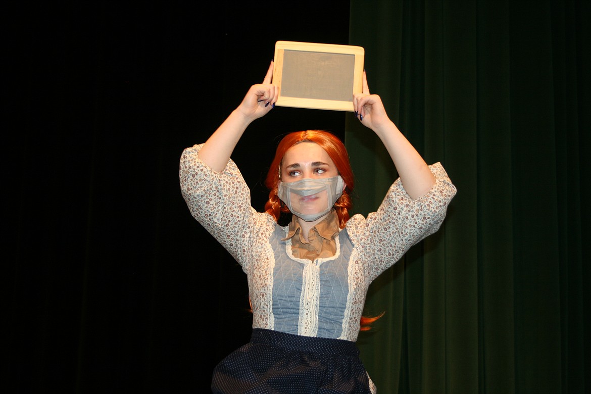 Having misbehaved in class Anne Shirley (Emma Foley) must have a seat on the shame stool. The Quincy High School production of "Anne of Green Gables" opens Thursday.