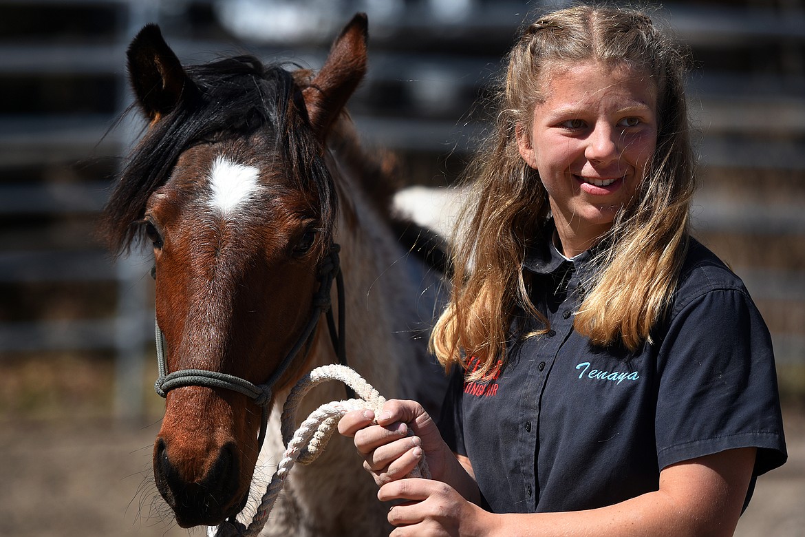 Fifteen-year-old trainer Tenaya Welsh works with her horse, Dragon, Saturday at Freedom Ranch. Welsh is training Dragon as part of the Extreme Mustang Makeover competition. (Jeremy Weber/Daily Inter Lake)